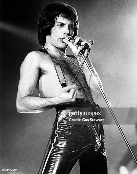 Freddie Mercury of Queen performing live on stage, bare-chested and wearing braces, Wembley Arena, London, 11th May 1978.