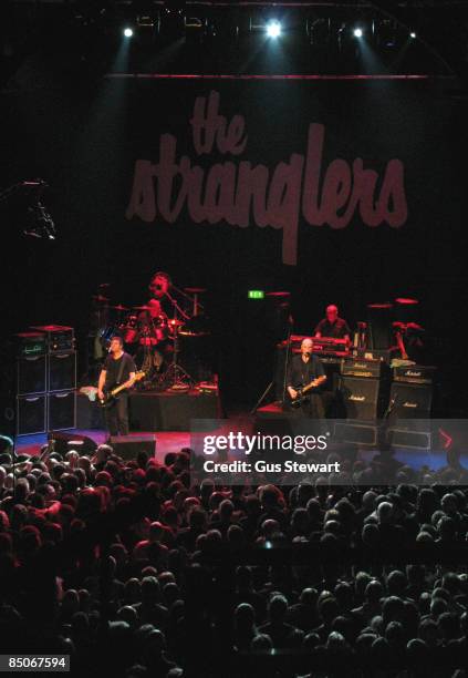 Photo of STRANGLERS, L-R Jean- Jacques Burnel, Jet Black, Baz Warne and Dave Greenfield performing live on stage at the 30th anniversary of their...