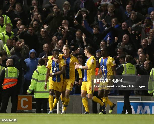 Crystal Palace's Wilfried Zaha celebrates in front of his team's fans after scoring his team's opening goal