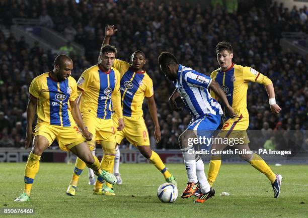 Brighton & Hove Albion's Kazenga LuaLua is surrounded by Crystal Palace players