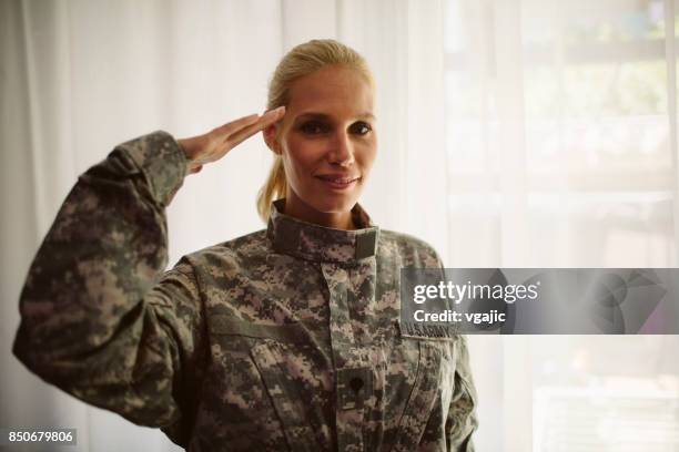 military mid adult woman saluting - st helena ethnicity stock pictures, royalty-free photos & images