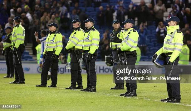 Police stand on the pitch after the final whistle