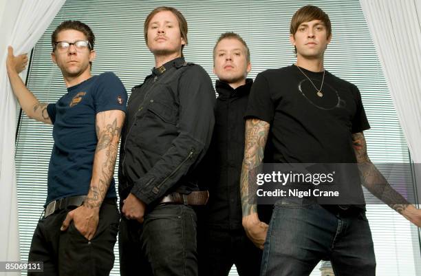 Photo of ANGELS & AIRWAVES; Posed group portrait - Adam 'Atom' Willard, Tom DeLonge, Matt Wachter and David Kennedy