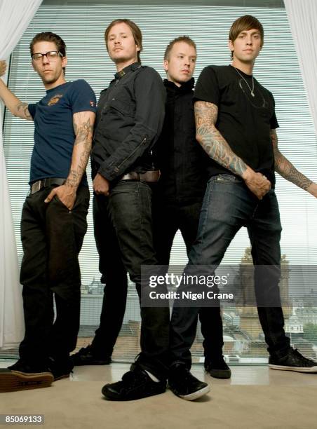 Photo of ANGELS & AIRWAVES; Posed group portrait - Adam 'Atom' Willard, Tom DeLonge, Matt Wachter and David Kennedy