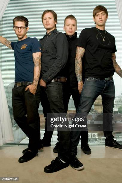 Photo of ANGELS & AIRWAVES; Posed group portrait - Adam 'Atom' Willard, Tom DeLonge, Matt Wachter and David Kennedy