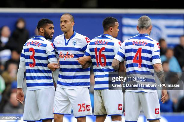 Queens Park Rangers' Bobby Zamora lines up a defensive wall with team-mates Armand Traore , Jermaine Jenas and Shaun Derry