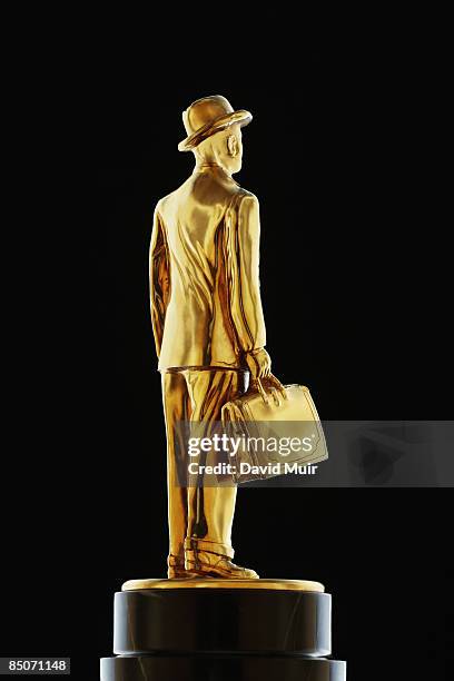 gold business man statue - businessman figurine stock pictures, royalty-free photos & images