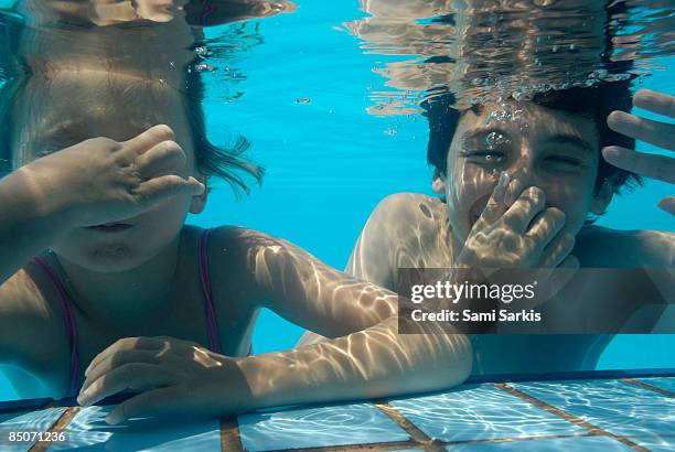 girl and boy in swimming pool - tunisia girl stock pictures, royalty-free photos & images