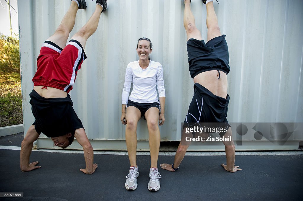 Corporate fitness, drills against shipping crate