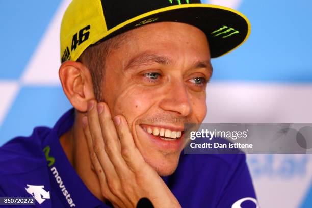 Valentino Rossi of Italy and Movistar Yamaha MotoGP smiles during a press conference during previews for the MotoGP of Aragon at Motorland Aragon...