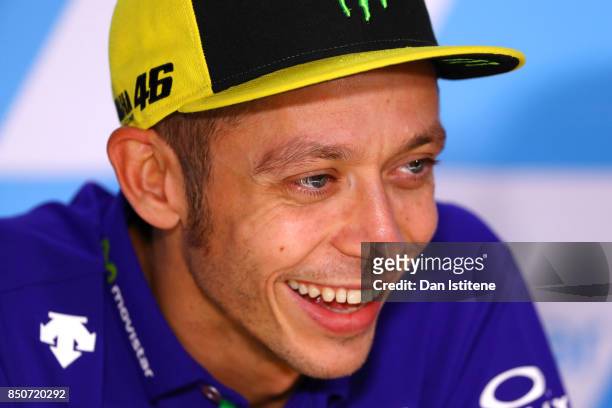 Valentino Rossi of Italy and Movistar Yamaha MotoGP smiles during a press conference during previews for the MotoGP of Aragon at Motorland Aragon...
