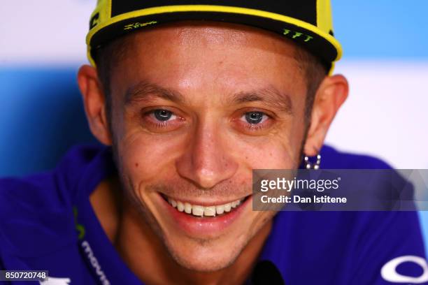 Valentino Rossi of Italy and Movistar Yamaha MotoGP smiles during a press conference during previews for the MotoGP of Aragon at Motorland Aragon...