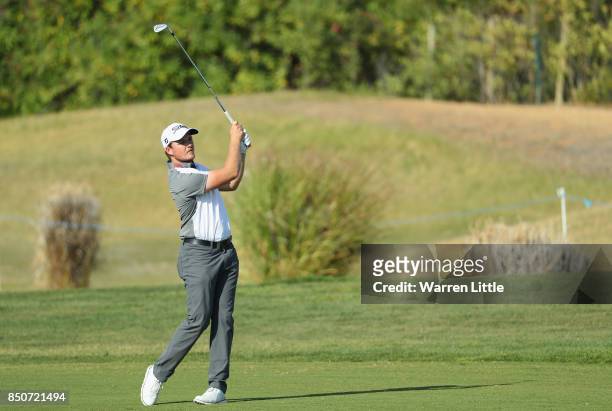 Eddie Pepperell of England plays his second shot on the 9th fairway during day one of the 2017 Portugal Masters at Dom Pedro Victoria Golf Club on...