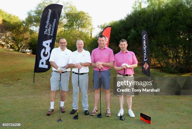 Simon Matthews of Low Laithes Golf Club and Adrian Ambler of Low Laithes Golf Club pose on the 1st tee with Gary Gruber of Royal Dornoch Golf Club...