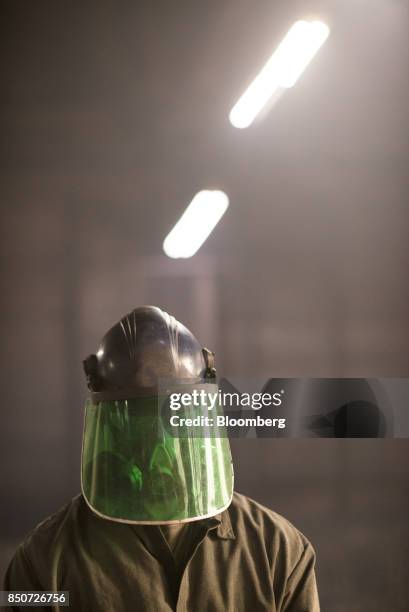 An employee works at the Lite Metals Co. Foundry in Ravenna, Ohio, U.S., on Wednesday, Sept. 20, 2017. The Lite Metals Co. Is a magnesium and...