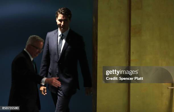 Canadian Prime Minister Justin Trudeau walks to the podium to address world leaders at the 72nd United Nations General Assembly at UN headquarters on...