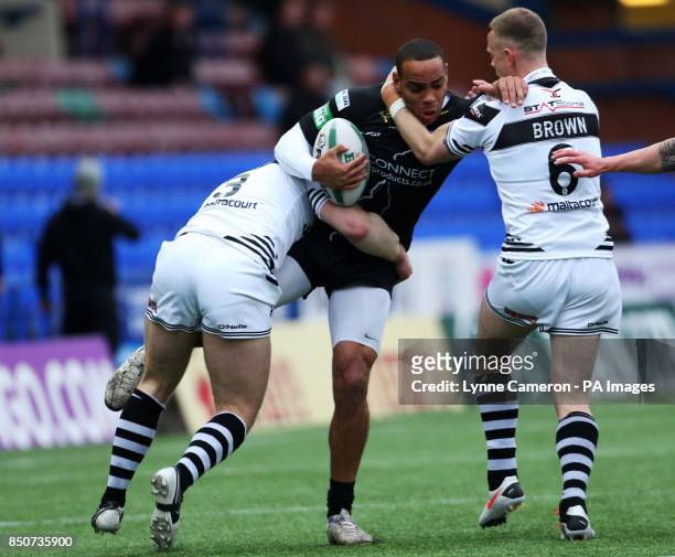 Widnes Viking's Cameron Phelps and Kevin Brown tackle Huddersfield's Leroy Cudjoe during the Super League match at the Stobart Stadium Halton,...