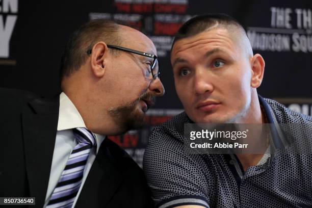 Vyacheslav Shabranskyy and manager Rolando Arellando disuss with one another during a press conference at the Renaissance New York Midtown on...