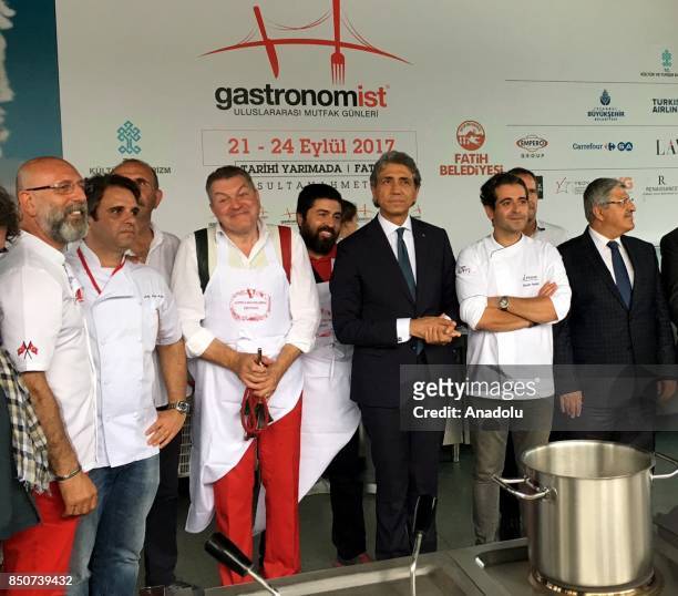 Turkish chef Cuneyt Arslan, Brazilian chef Andre Lima de Luca, Italian chef Dario Cecchini and mayor of Fatih District, Mustafa Demir pose for a...