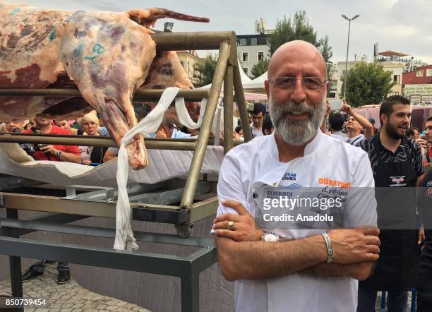 Well-known Turkish chef Cuneyt Arslan poses form a photo during the "Gastronomist 2017: World Culinary Cultures" at Sultanahmet Square in historical...
