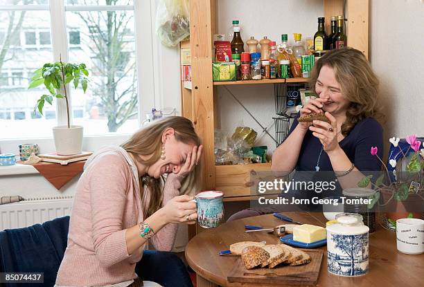 two females having breakfast - tea for two stock-fotos und bilder