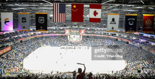 Fan waves the towel during a pre-season National Hockey League game between the Vancouver Canucks and the Los Angeles Kings at Mercedes-Benz Arena on...