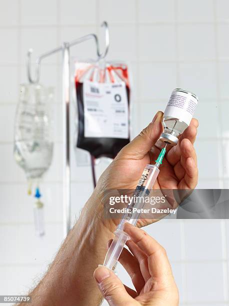 filling adrenaline syringe in hospital. - injecting iv stock pictures, royalty-free photos & images