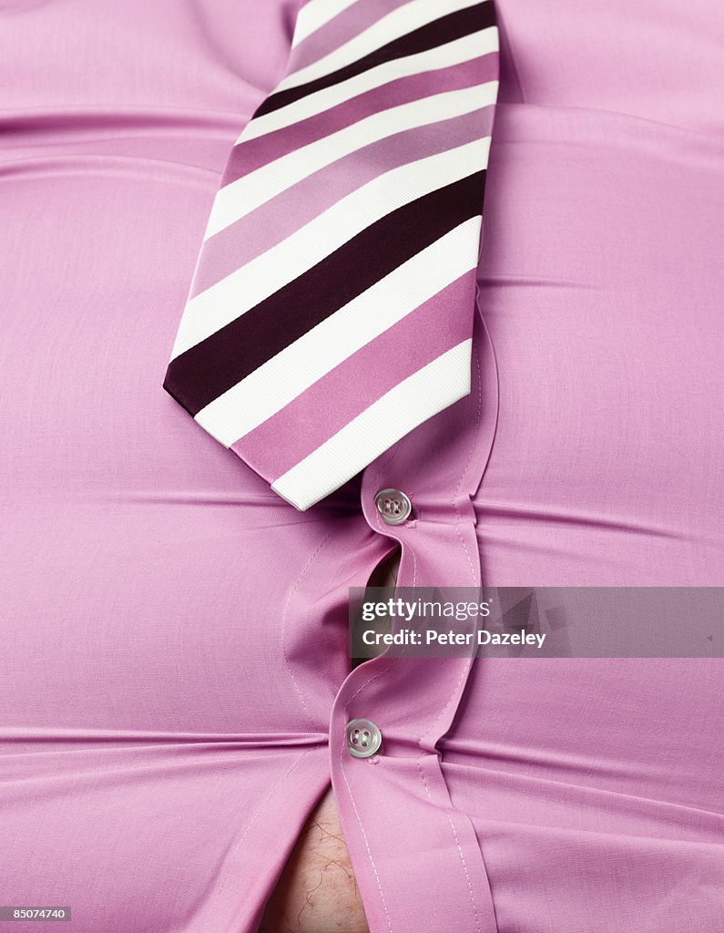 Obese man with pink shirt gaping open.