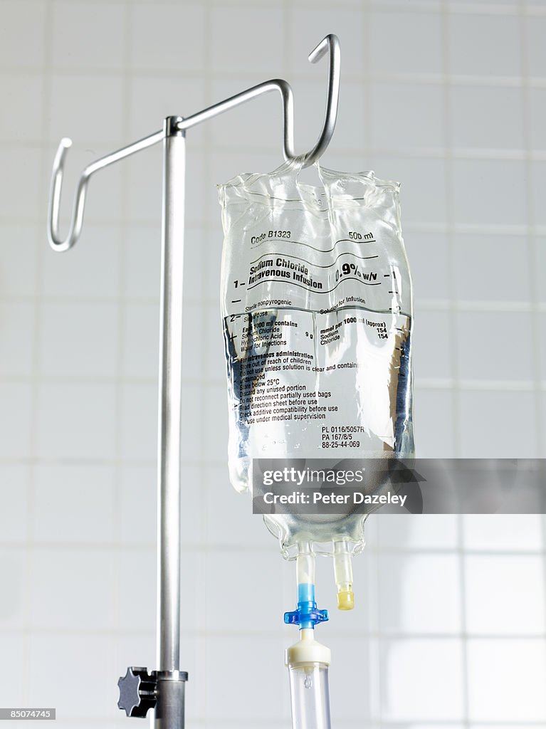 Saline drip on stand in hospital.