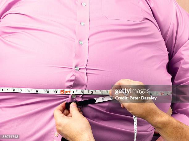 obese man with 72 inch waist - obesidad fotografías e imágenes de stock