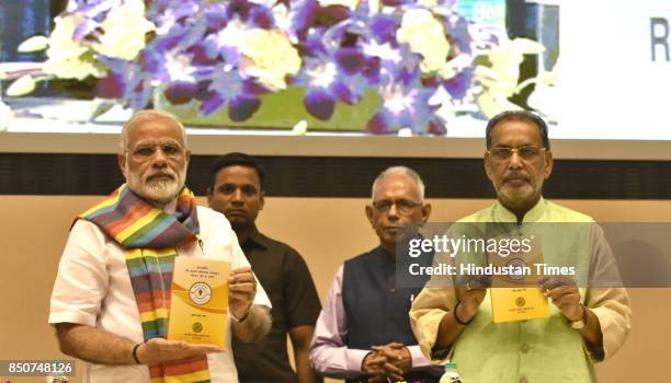 Prime Minister Narendra Modi releases the book on Indian Co-operative Movement at the birth centenary celebration of Laxman Rao Inamdar and Sahakar...