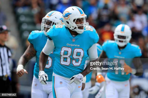 Julius Thomas of the Miami Dolphins runs off the field during the second half of a game against the Los Angeles Chargers at StubHub Center on...