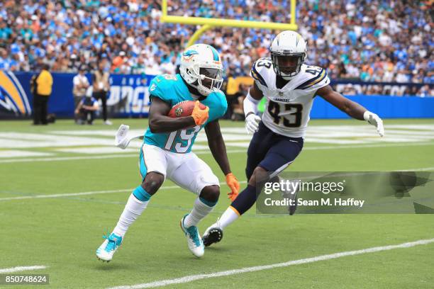 Michael Davis of the Los Angeles Chargers chases Jakeem Grant of the Miami Dolphins during the first half of a game at StubHub Center on September...