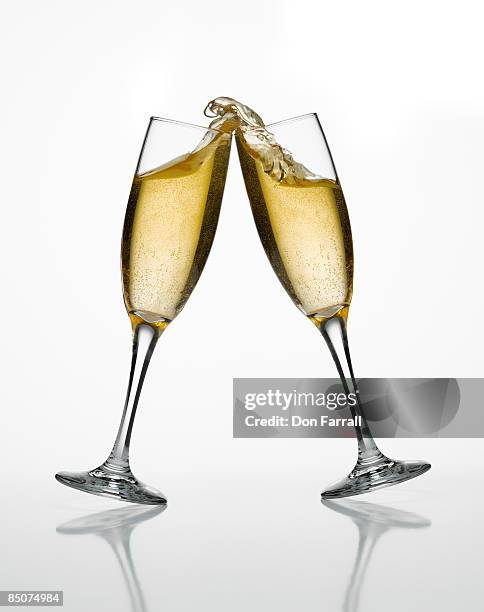 champagne glasses toasting - champagne flute white background stock pictures, royalty-free photos & images