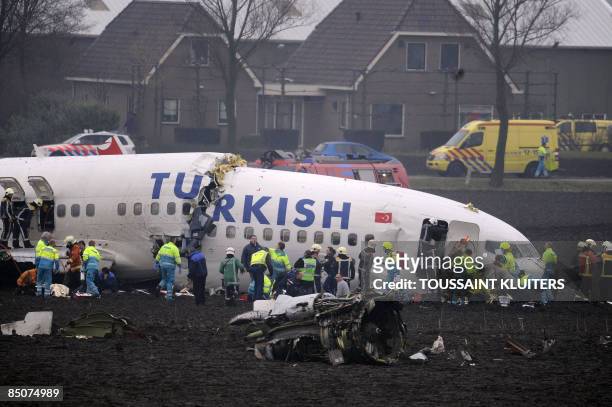 Passenger plane operated by Turkish Airlines lies broken after crashing while trying to land at Schiphol airport in Amsterdam on February 25, 2009....