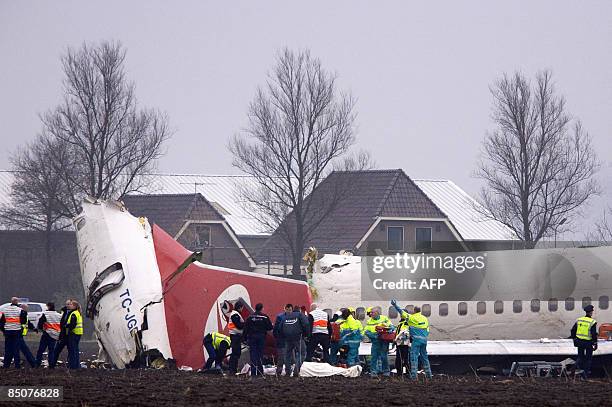 Emergency services work at the scene of a Turkish Airlines passenger plane which crashed on February 25, 2009 while landing at Schiphol airport in...