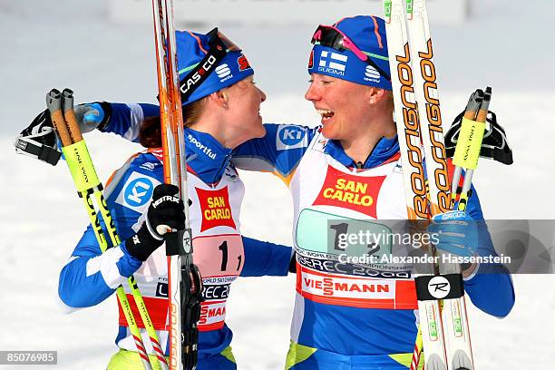 Aino Kaisa Saarinen and Virpi Kuitunen of Finland celebrate after winning the Gold medal during the Ladies Cross Country Team Sprint Final at the FIS...