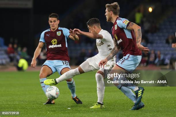 Ashley Westwood of Burnley and Pablo Hernandez of Leeds United during the Carabao Cup Third Round match between Burnley and Leeds United at Turf Moor...