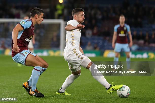 Ashley Westwood of Burnley and Pablo Hernandez of Leeds United during the Carabao Cup Third Round match between Burnley and Leeds United at Turf Moor...