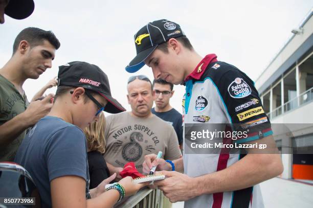 Alex Marquez of Spain and EG 00 Marc VDS signs autographs for fans at the end of the press conference during the MotoGP of Aragon - Previews at...