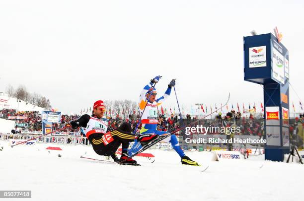 Axel Teichmann of Germany beats Ville Nousiainen of Finland across the finish line by the smallest of margins to win the Silver medal during the...