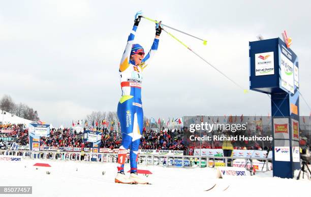Virpi Kuitunen of Finland celebrates as she crosses the finish line to win the Gold medal during the Ladies Cross Country Team Sprint Final at the...