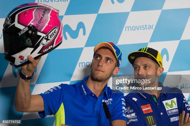 Alex Rins of Spain and Team Suzuki ECSTAR shows the new helmet for this race during the press conference during the MotoGP of Aragon - Previews at...