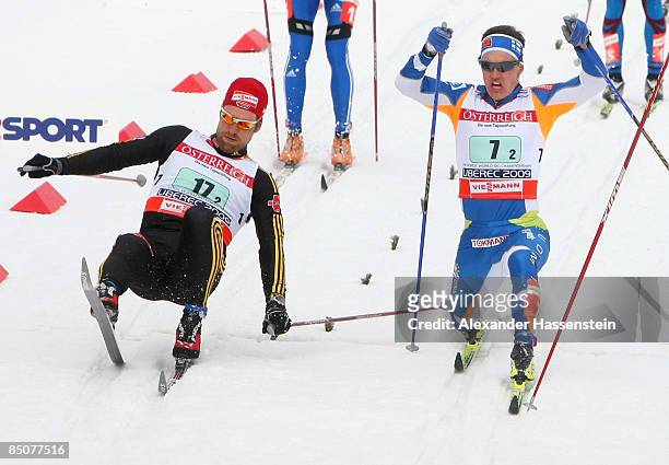 Axel Teichmann of Germany beats Ville Nousiainen of Finland across the finish line by the smallest of margins to win the Silver medal during the...