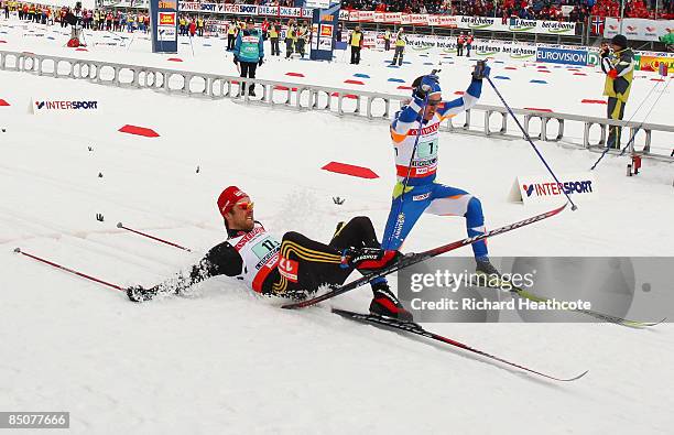 Axel Teichmann of Germany beats Ville Nousiainen of Finland across the finish line by the smallest of margins to win the Silver medal during the...