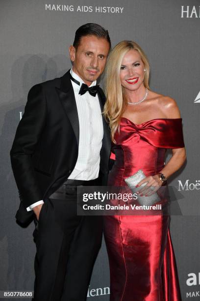 Federica Panicucci and Marco Bacini walk the red carpet of amfAR Gala Milano on September 21, 2017 in Milan, Italy.