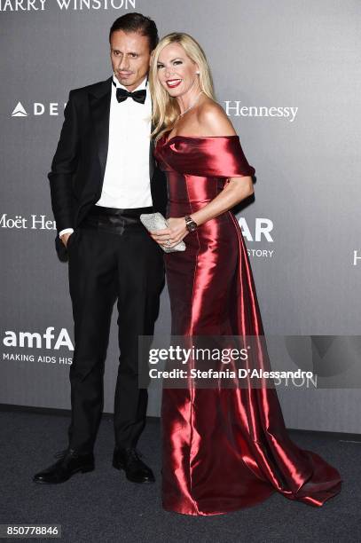 Federica Panicucci and Marco Bacini walk the red carpet of amfAR Gala Milano on September 21, 2017 in Milan, Italy.