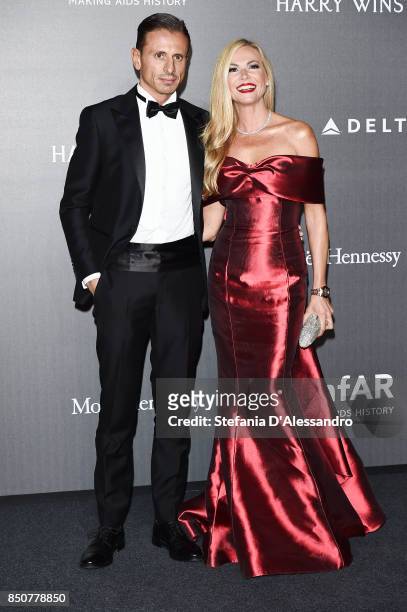 Federica Panicucci and Marco Bacini walk the red carpet of amfAR Gala Milano on September 21, 2017 in Milan, Italy.