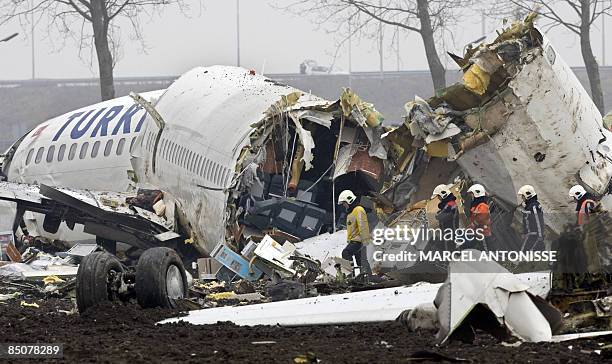 Emergency services work at the scene of a Turkish Airlines passenger plane which crashed on February 25, 2009 while landing at Schiphol airport in...