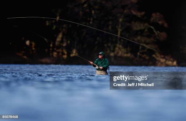 Fisherman casts on the lower Crathes beat on The River Dee on February 25, 2009 in Banchory, Scotland. Internationally renowned for its salmon...